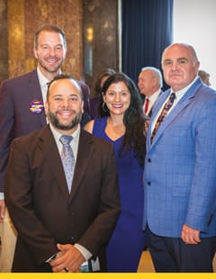 Senator Jean-Paul Morrell (front), pictured with Dr. Todd Tartavoulle, Dr. Jessica Landry and Dr. Demetrius Porche, presented the senate resolution recognizing the School of Nursing.