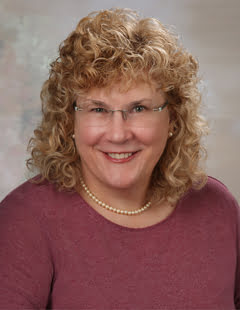Paula Kensler, DNP, MBA, RN, Program Director for the Clinical Nurse Leader Master’s and Executive Nurse Leader Doctor of Nursing Practice (DNP) programs and Instructor of Clinical Nursing, is pictured in a headshot.
