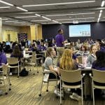 Students are shown working together in table groups.